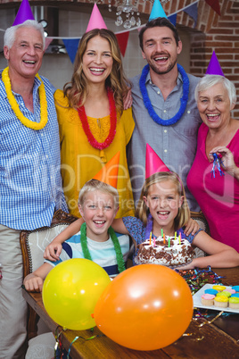 Portrait of smiling multi generation family celebrating birthday