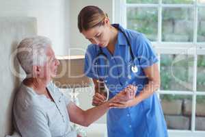 Nurse examining senior man