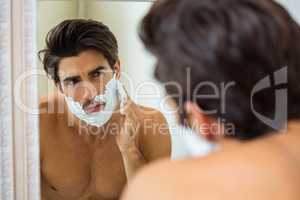 Man applying shaving foam