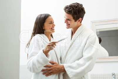 Happy couple checking pregnancy test