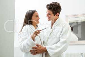 Happy couple checking pregnancy test