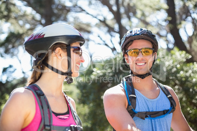 Smiling young couple at forest