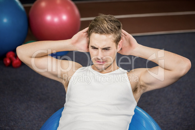 Man working out on fitness ball