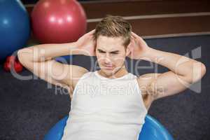 Man working out on fitness ball