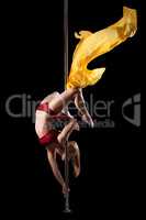 Woman show exercise in pole dance with fabric