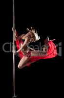 Woman jump during pole dance with fabric