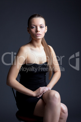 Image of beautiful young woman looking at camera