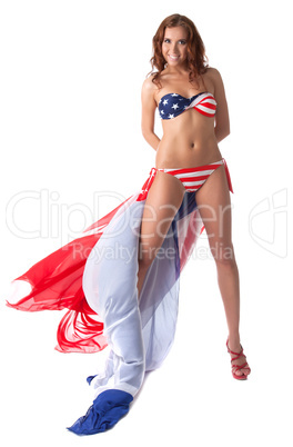 Smiling girl posing in swimsuit with american flag