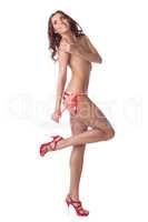 Cheerful model posing topless in striped panties