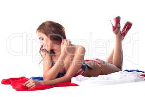 Smiling model shows swimsuit with american flag