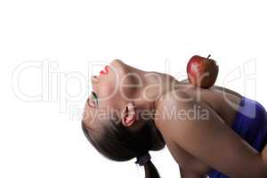 Portrait of flexible young girl posing with apple