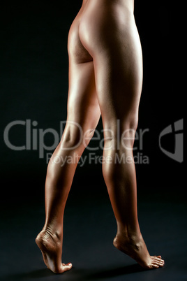 Slender female legs like bronze statue