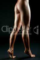 Slender female legs like bronze statue