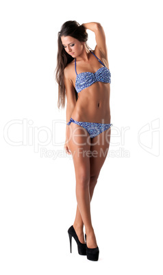 Studio shot of leggy model posing in blue bikini