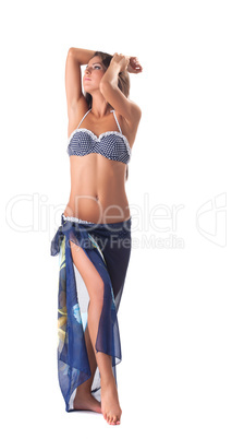 Young girl posing in polka dot bikini with pareo