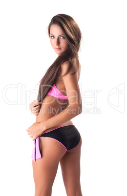 Portrait of beautiful brunette posing in swimsuit