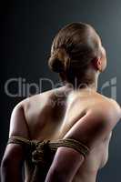 Rear view of girl's hands tightened rope