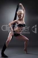 Shot of sensual young blonde dancing with cloth