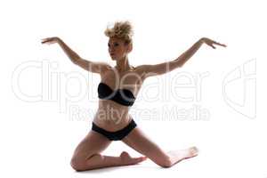 Attractive slim dancer posing in black lingerie