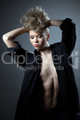 Portrait of angry slim blond posing in black shirt