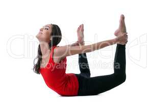 Beautiful slim woman doing stretching in studio