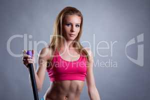 Portrait of pretty young athlete with fitbar