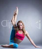 Image of pretty sportswoman doing stretching