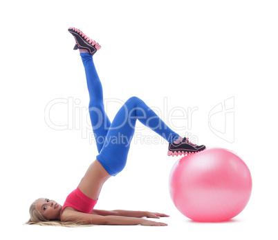 Model doing stretching exercises with fitness ball