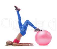 Model doing stretching exercises with fitness ball
