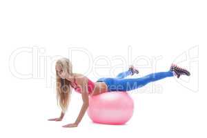 Image of sporty blonde exercising on fitness ball