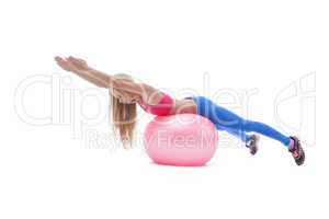 Beautiful fitness trainer exercising with ball