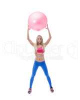 Pretty long-haired sporty model posing with ball