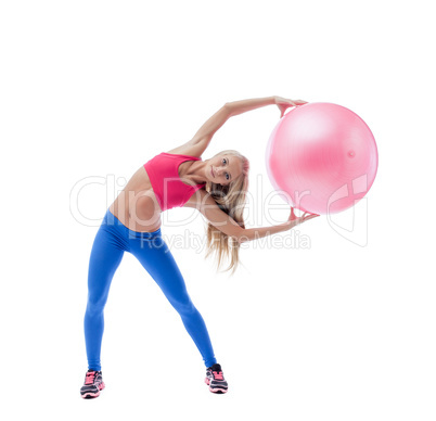 Beautiful slim woman exercising with fitness ball