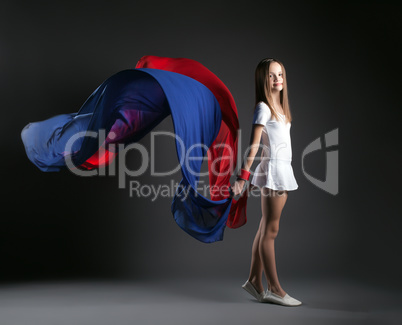 Image of smiling girl posing with colorful cloth