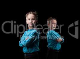 Studio shot of serious little twin brothers