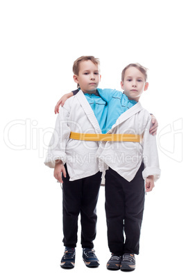 Image of little twin boys pretending siamese