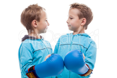 Cute twin boys posing looking at each other