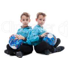 Image of amusing twin brothers posing with balls