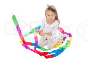 Adorable little girl posing with colorful ribbon