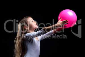 Emotional rhythmic gymnast dancing with ball