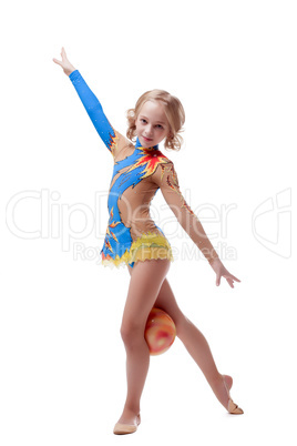 Little artistic gymnast posing looking at camera