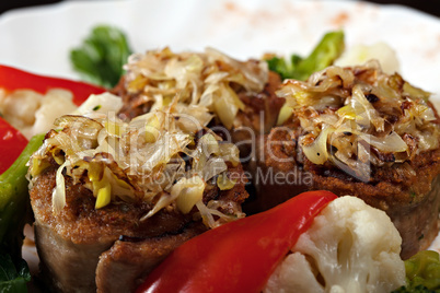 Appetizing meat rolls stuffed with vegetables