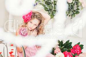 Beautiful elegant girl posing with flower in studio