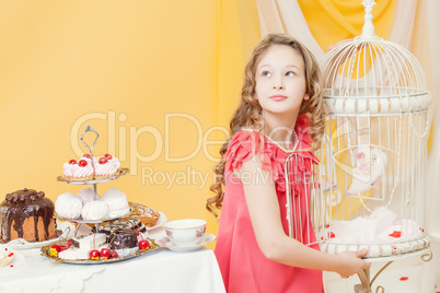 Elegant curly girl posing in festive interior