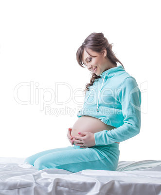 Image of pregnant woman gently stroking her belly