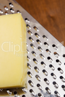 Piece of cheese and grater