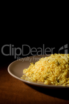 Risotto with Saffron on wooden table