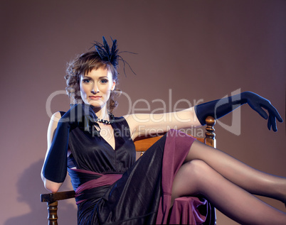 Retro middle aged actress posing looking at camera