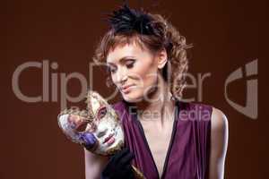 Actress posing with mask. Concept of Two-Face.