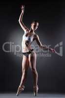 Shot of slim graceful ballerina posing in lingerie